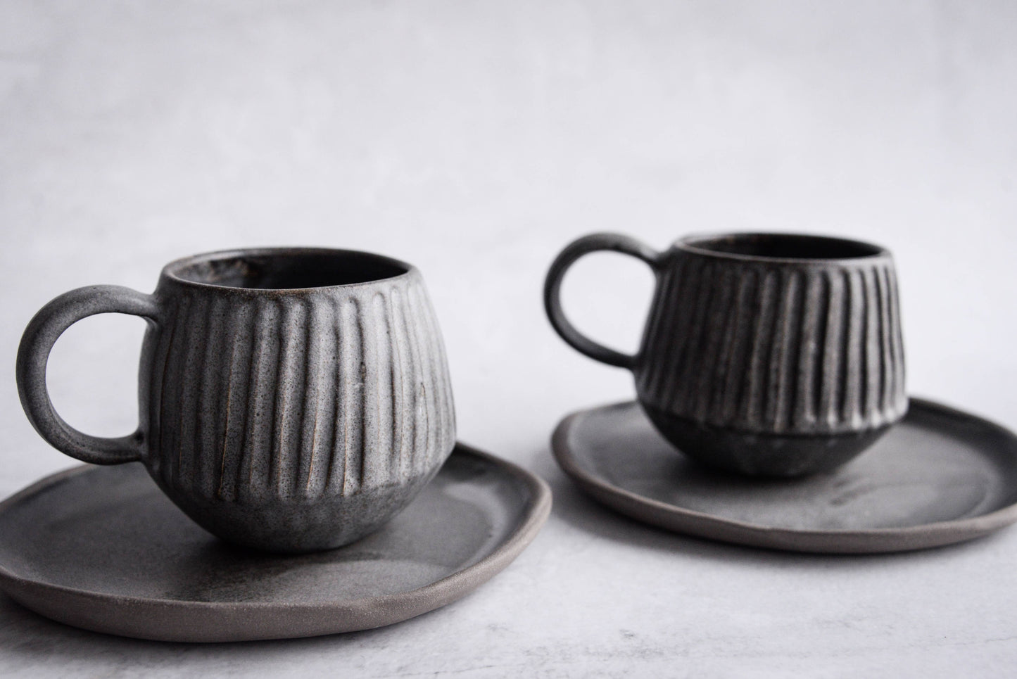 Stoneware carved mug and saucer - black / grey