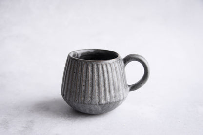 Stoneware carved mug and saucer - black / grey