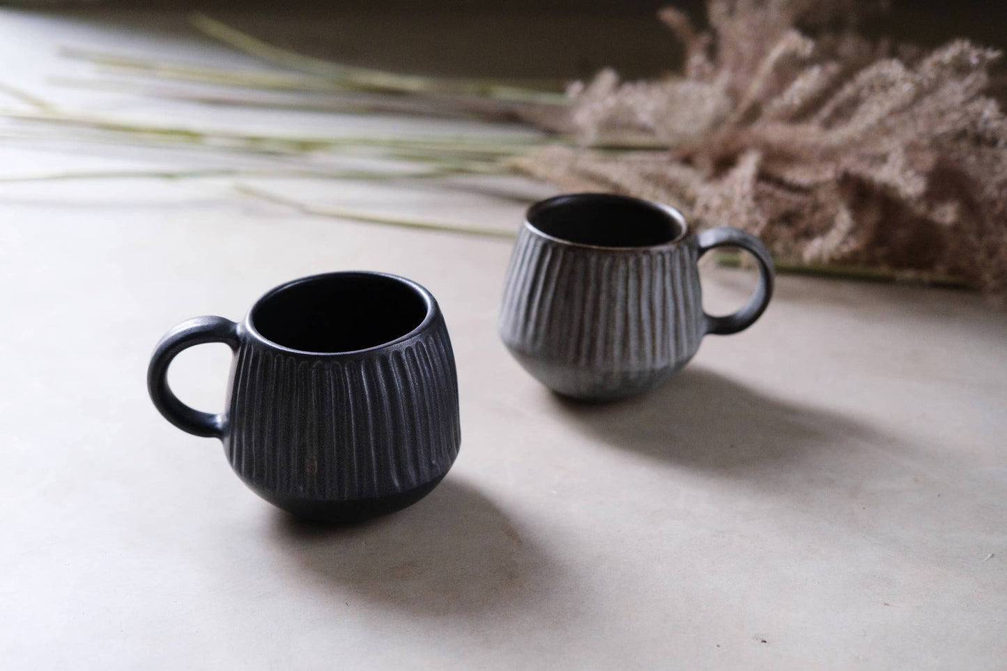 Stoneware carved mug and saucer - black / grey