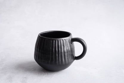 Stoneware carved mug and saucer - black / grey