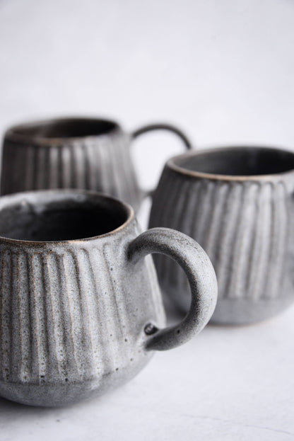 Stoneware carved mug and saucer - black / grey